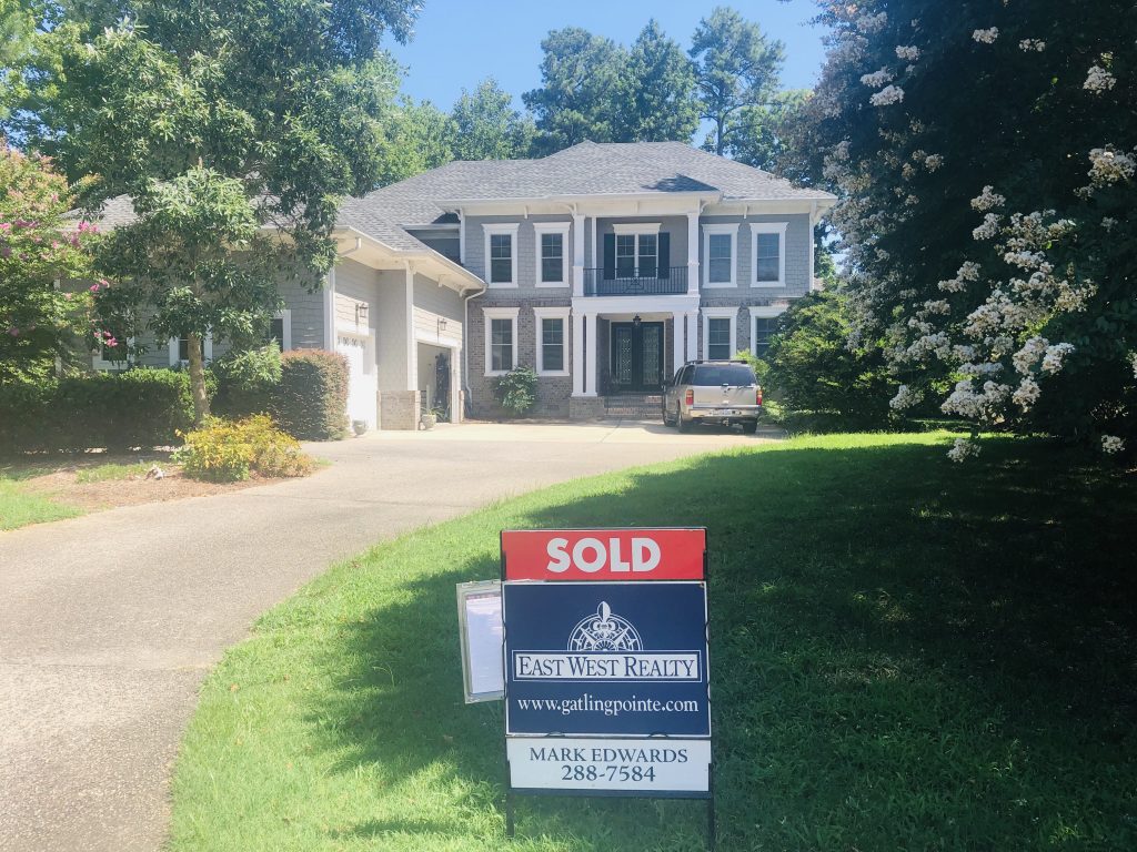 Home With Sold Sign